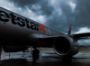 View of airplane against cloudy sky