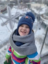 Portrait of cute girl making a face in snow