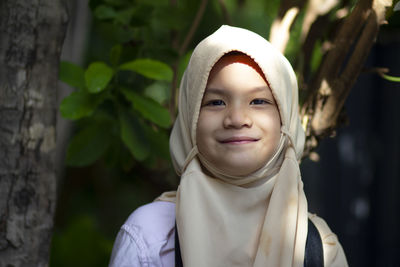 Muslim school kid.pretty little girl in hijab looking and smile to camera.happy kid.