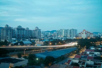 High angle view of illuminated cityscape against sky