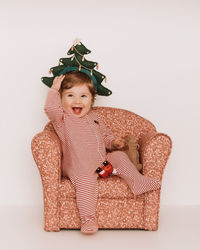 Portrait of baby boy with christmas tree headband