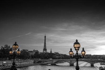 Street light in city against sky