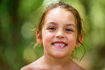 Close-up portrait of shirtless girl
