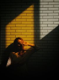 Sunlight falling on woman in building