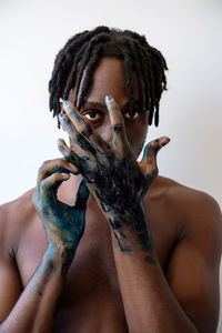 Artistic black man with painted hands