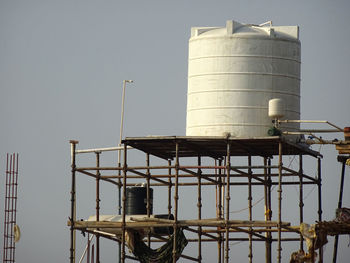 Low angle view of water tower against sky