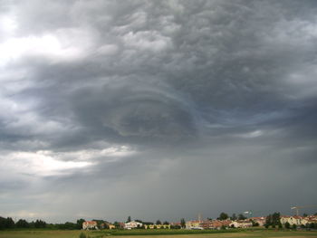 Storm clouds over city buildings