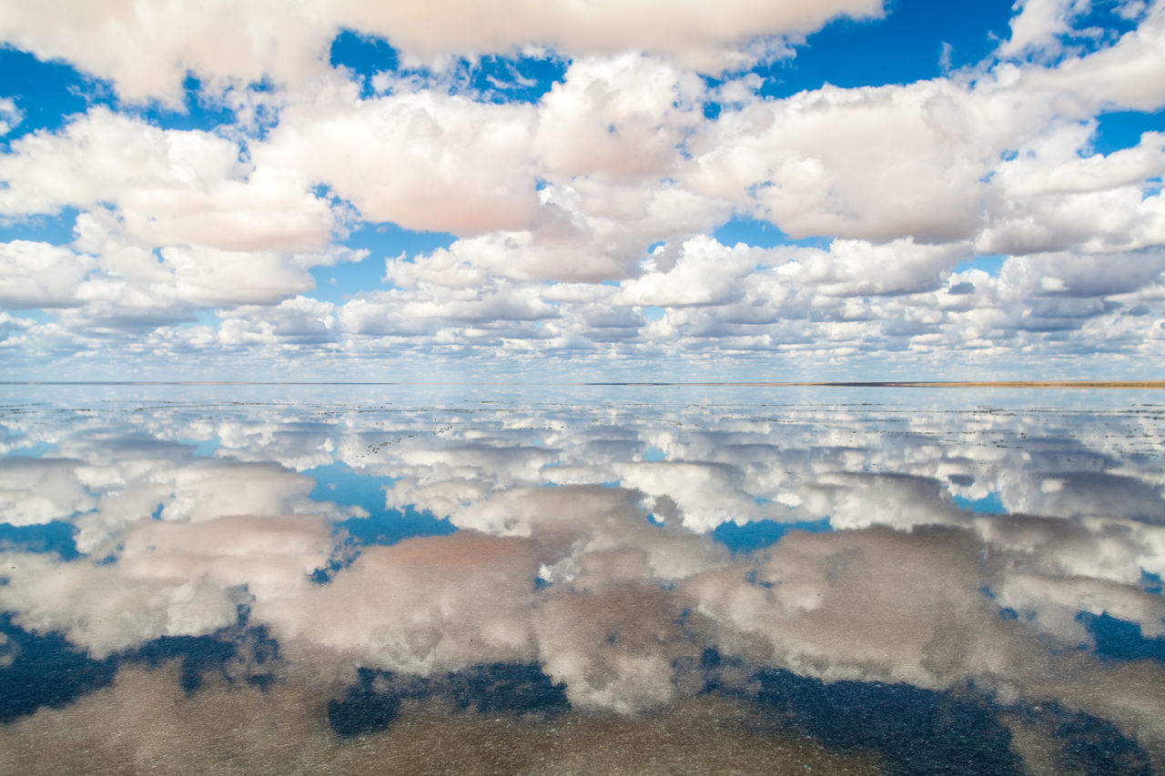 cloud - sky, sky, scenics - nature, beauty in nature, tranquil scene, tranquility, nature, no people, day, water, environment, land, blue, reflection, sea, beach, landscape, non-urban scene, idyllic, outdoors, salt flat