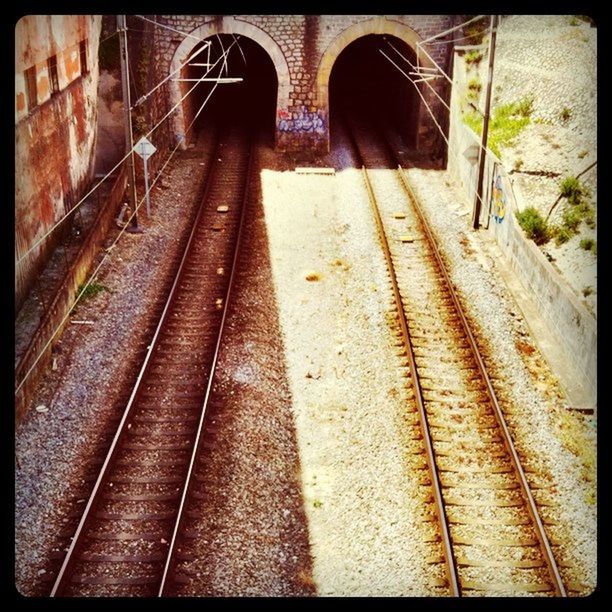 transfer print, railroad track, auto post production filter, transportation, rail transportation, built structure, high angle view, architecture, public transportation, railroad station platform, railroad station, the way forward, steps, diminishing perspective, railing, day, indoors, sunlight, railway track