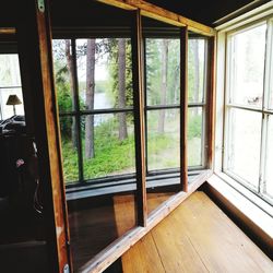 Close-up of window on hardwood floor in house