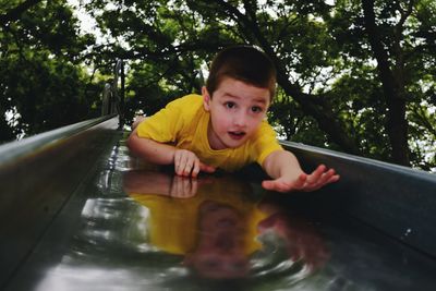 Portrait of boy on slide