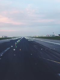 Road passing through dramatic sky