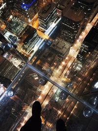 High angle view of illuminated city buildings at night