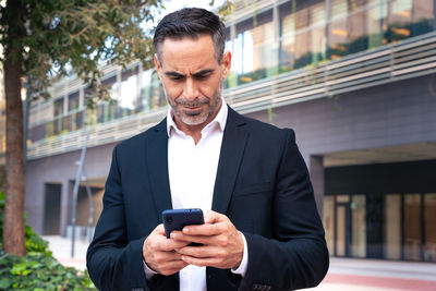 Young man using mobile phone