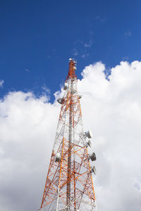 Low angle view of communications tower against sky