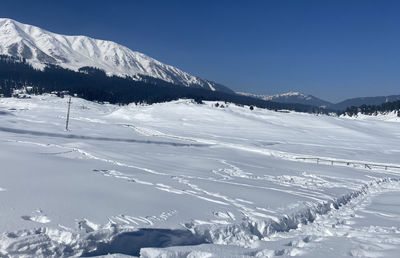 Scenic view of snowcapped mountains against sky