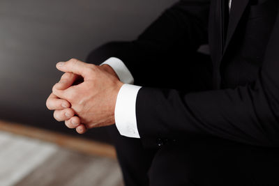Midsection of businessman shaking hands