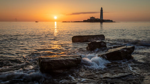 Scenic view of sea against sky during sunset