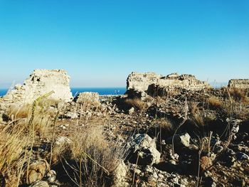 Scenic view of sea against clear blue sky