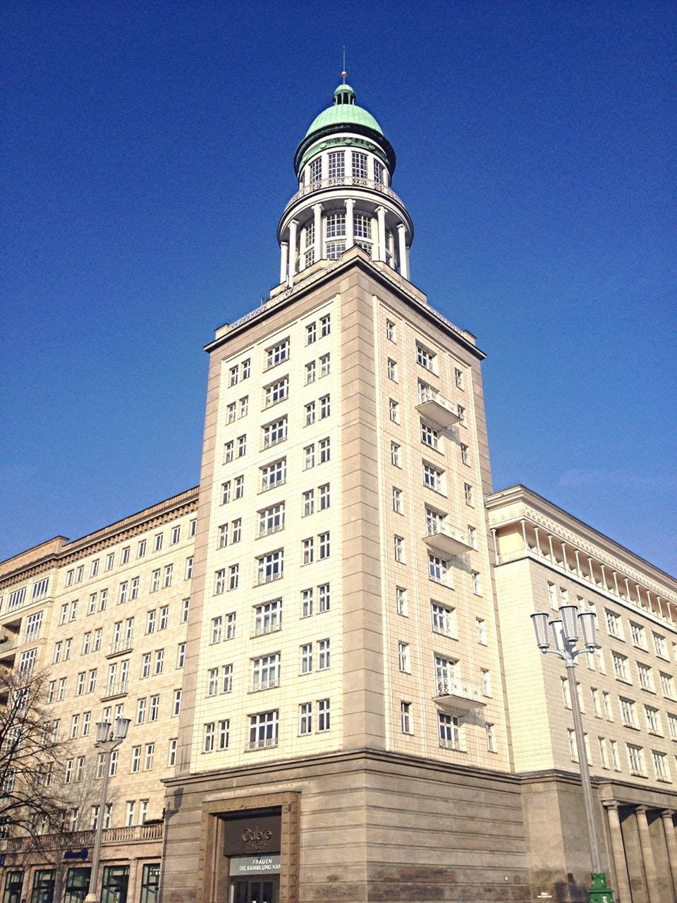 architecture, building exterior, built structure, low angle view, clear sky, blue, tower, city, famous place, travel destinations, tall - high, church, clock tower, religion, day, sunlight, window, outdoors, facade