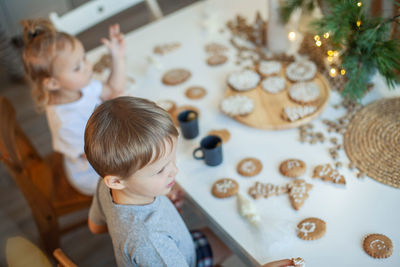 Cute boy playing on table