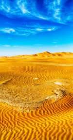 Surface level of desert against sky