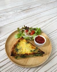 Directly above shot of pizza served in plate