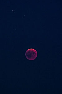 Low angle view of moon against sky at night