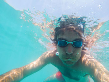 Portrait of man swimming in sea