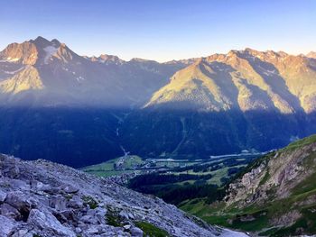 Scenic view of mountains against clear blue sky