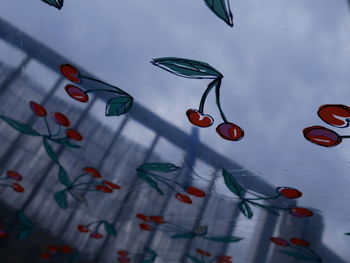 Low angle view of decoration hanging against wall
