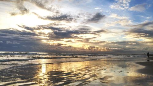 Scenic view of sea against dramatic sky