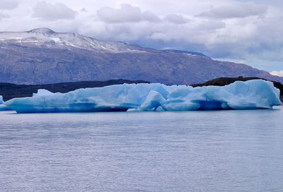 Scenic view of frozen lake against sky