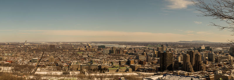 High angle view of modern buildings in city against sky