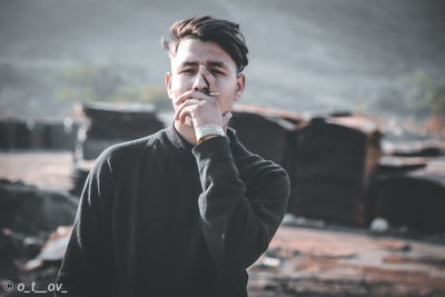 Portrait of young man looking away