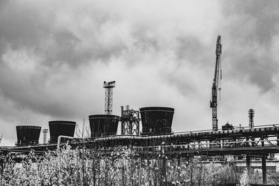 Low angle view of smoke stack against sky