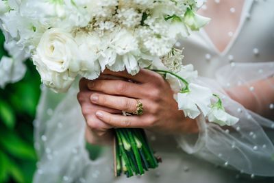 Close-up of hand holding bouquet