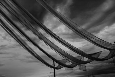 Low angle view of rollercoaster against sky