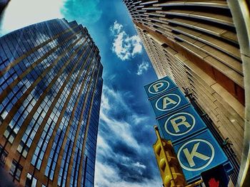 Low angle view of building against cloudy sky