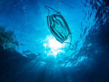 Low angle view of mask in sea