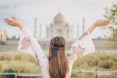 Girl in taj mahal public place - unesco world heritage at agra, india