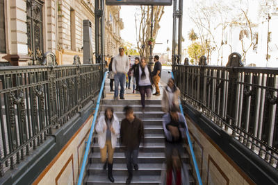 People walking on footbridge