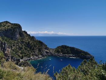 Scenic view of sea against blue sky