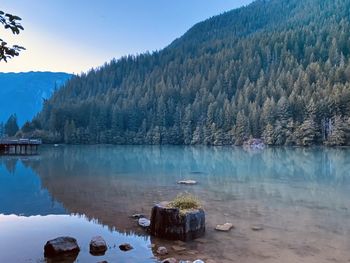 Scenic view of lake and mountains against sky