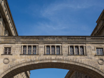 Low angle view of historical building against blue sky