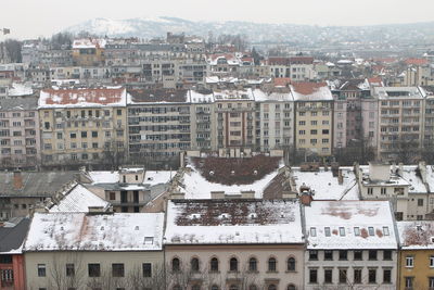 High angle view of buildings in city during winter