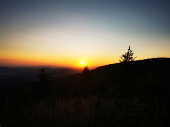 Scenic view of silhouette landscape against sky during sunset