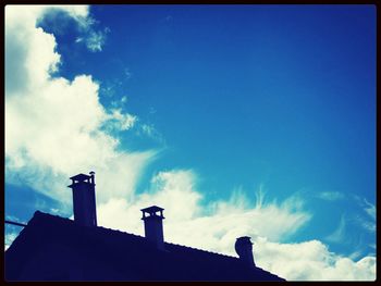 High section of building against blue sky