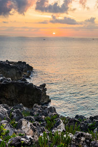 Scenic view of sea against sky during sunset