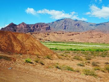 Scenic view of landscape and mountains against sky